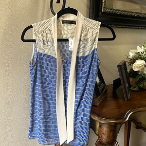 Women’s sleeveless blouse
Never worn with tags